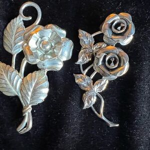 2 Sterling Rose Pins. Marked Sterling.